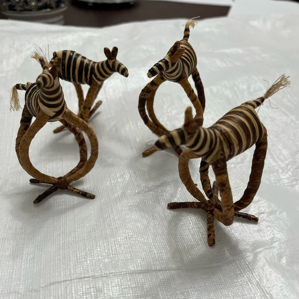 Four hand woven napkin holders